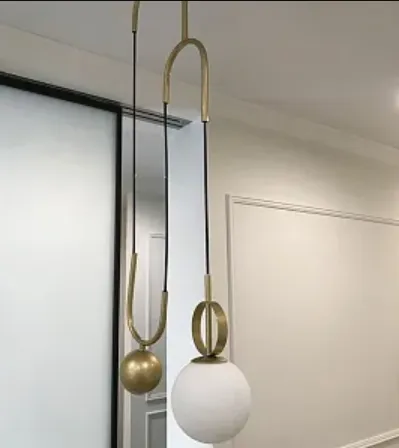 Designerskie lampy wiszące z mosiądzu